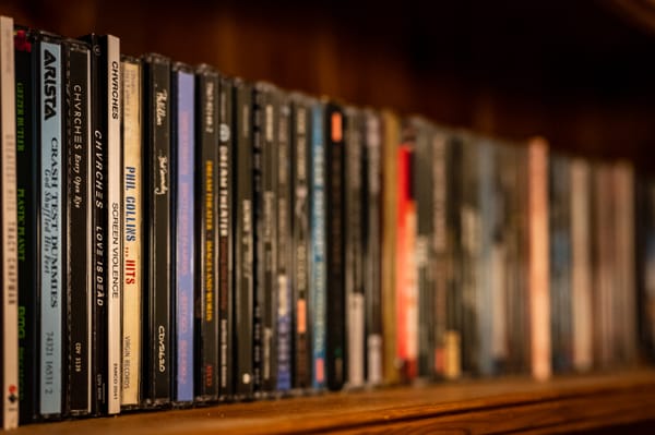 A shelf full of CDs