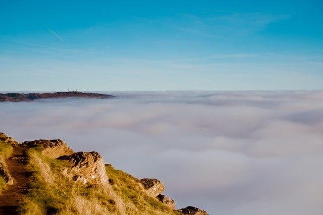 A mountain outcrop above the clouds